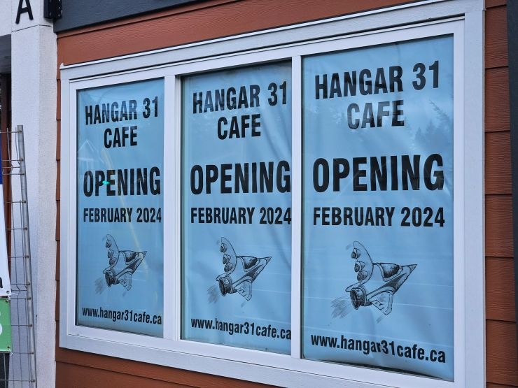 Hangar 31 Cafe opening signs in the cafe windows